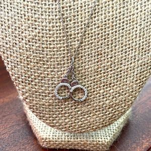 Roberto Coin diamond handcuffs w/ signature ruby on the backside.